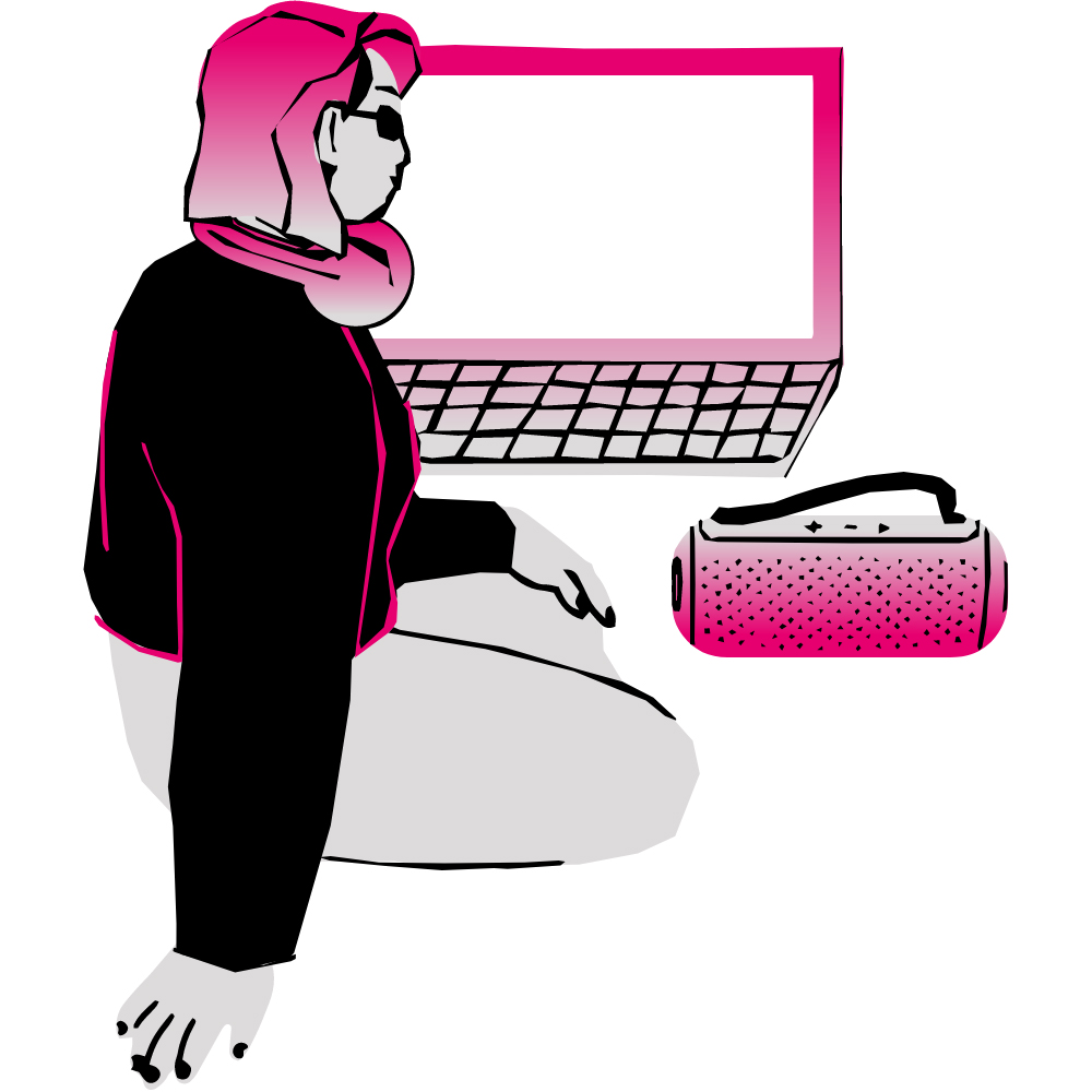 person sitting by computer and a radio