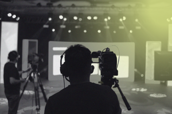 Man with video camera in studio