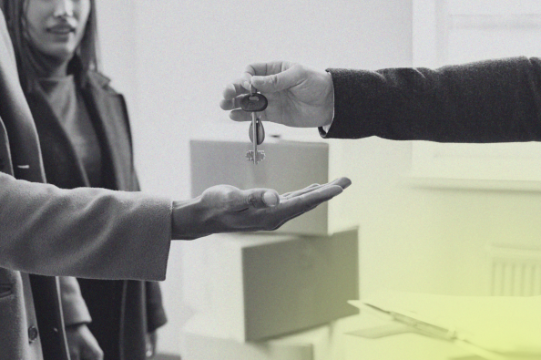 person handing keys to someone else