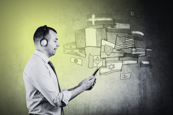 image of a man watching a video on his phone with various flags in the background