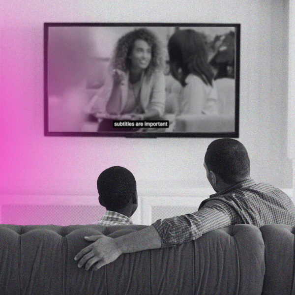 father and son watching tv with subtitles
