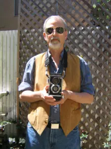 Pete Eckert holding a camera